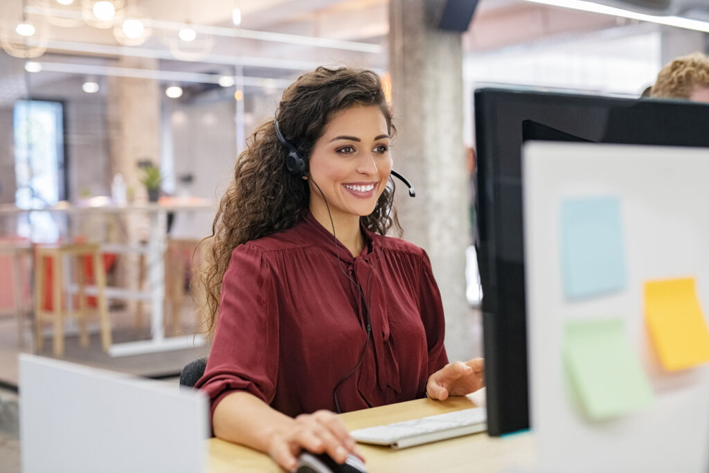 Happy smiling woman working in call center